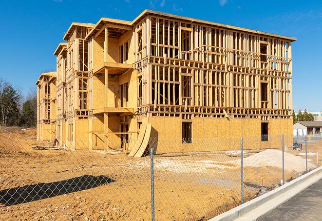 construction zone secured with a temporary fence, marked with warning signs in Jacksboro